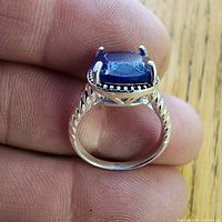 Ring profile showing blue stone and setting