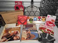 Group shot showing all bakeware, tools, and cookbooks