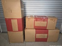 Three Balsam Hill cartons containing sections of the Vermont White Spruce tree