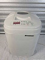 Front and side view of Breadman TR444 bread maker showing overall form and exterior condition