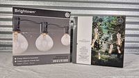 Front view of both boxed string light sets