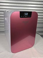 Front view showing pink door and digital display