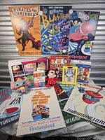 Group shot of all items including posters on wall and items arranged below