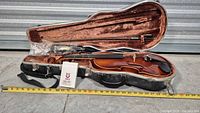 Open hard case showing Glaesel VA10E viola, bow, accessories and measuring tape for scale