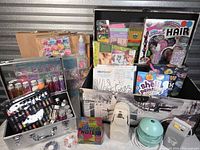 Wide view of entire lot including easels, trunk, cases and kits