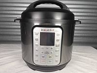 Front view of Instant Pot Duo Plus showing full unit with lid attached