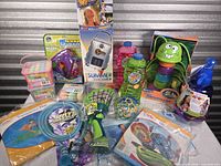 All items together showing variety of toys, solar shower, bubbles, chalk and inflatables