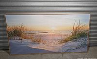 Front view of beach landscape canvas in frame