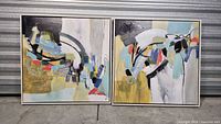 Both framed abstract canvas prints side by side