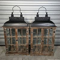 Front view of both matching wood and metal lanterns