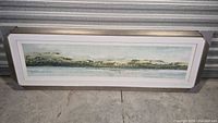 full view of framed abstract coastal print in silver frame