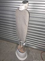 Full view of Sylintech garment steamer showing base, poles, attached ironing board and steam head