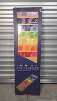 Front of boxed Tabletop Rainbow Shuffleboard set