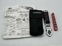 All components laid out: wrench, pouch, socket rail, instructions