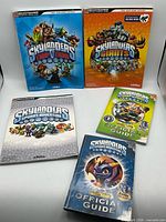 All five Skylanders strategy guides laid out