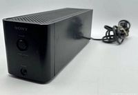 Front angled view showing overall amplifier and attached power cord