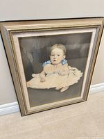 Full view of framed baby portrait