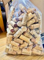 Bag filled with assorted natural, champagne and synthetic corks