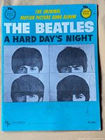 Front cover showing title, price, publisher and Beatles photos