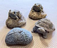 group shot of all four cement garden figures