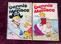 Dennis the Menace No.67 and No.96 front covers visible