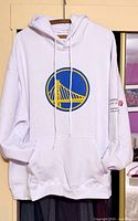 Front of white hoodie showing Warriors logo and kangaroo pocket