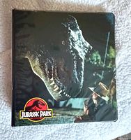Front of Jurassic Park binder with T-Rex artwork