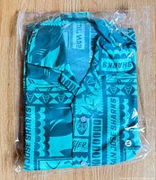 Shirt folded in clear plastic packaging