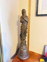 Full view of resin angel statue on pedestal base