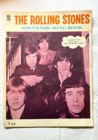 Front cover showing title, band photo and price