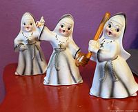 Group shot of all three nun figurines