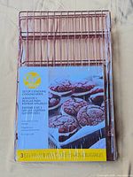 Front view of packaged Wilton set of 3 stacking cooling grids