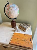 Group shot showing globe, squirrel, trinket box and notebook