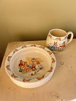 plate and mug together showing matching Bunnykins design