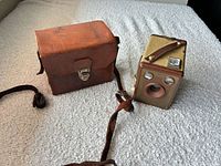 Camera and leather case, overall view