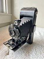 Camera unfolded showing bellows, lens, and front standard