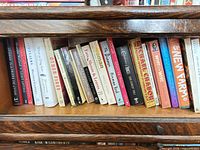 Full view of first shelf section showing left-side book spines