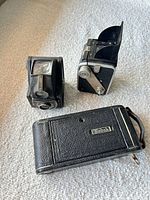 Front view of all three cameras showing lenses and bodies