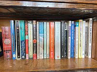 Top shelf showing first group of vertically aligned books including Canada, Wordsworth: The Prelude, and others