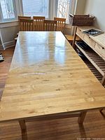 Top view of the solid wood dining table showing natural finish and size