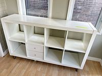 Front view showing 8 cubes, 2 drawers, metal legs