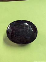 Top view of oval faceted amethyst stone