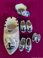 Overhead view of all Delft Blue ceramic shoes and boot