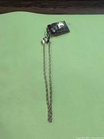 full view of gold plated rope chain bracelet with attached tag