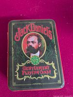 Top view of Jack Daniel's Gentlemen's Playing Cards tin showing lid graphics