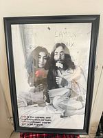 Full view of framed poster showing image, frame, and size context