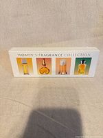 Front of display box showing four fragrances