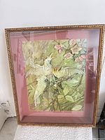 Front view of framed 3D paper relief artwork under glass