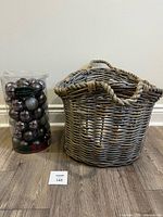 Wicker basket and sealed ornament package side by side
