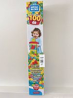 Side view of sealed Mega Bloks box showing toddler and Sky High Building graphics